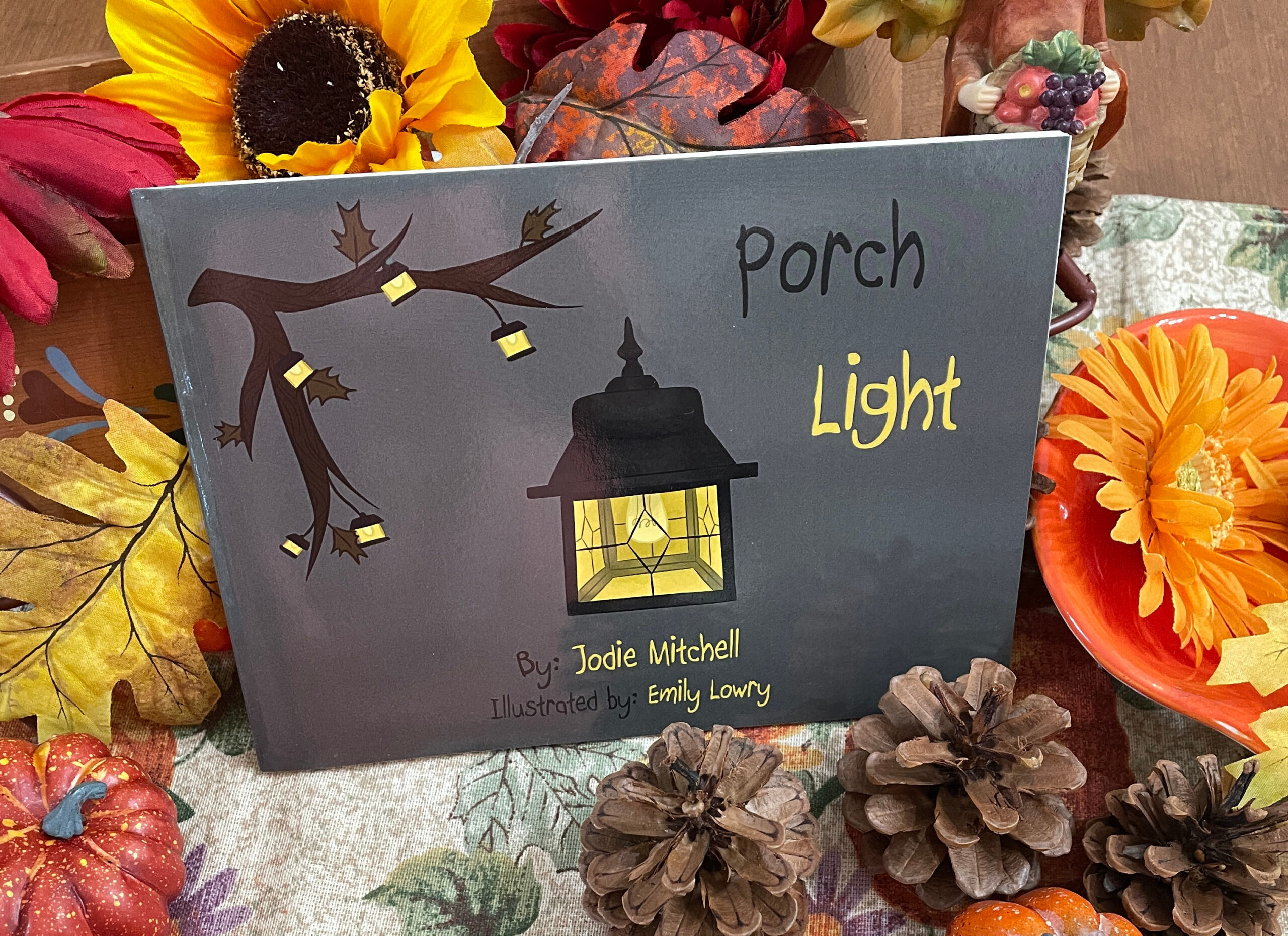 pink rose in gray ceramic vase on white table