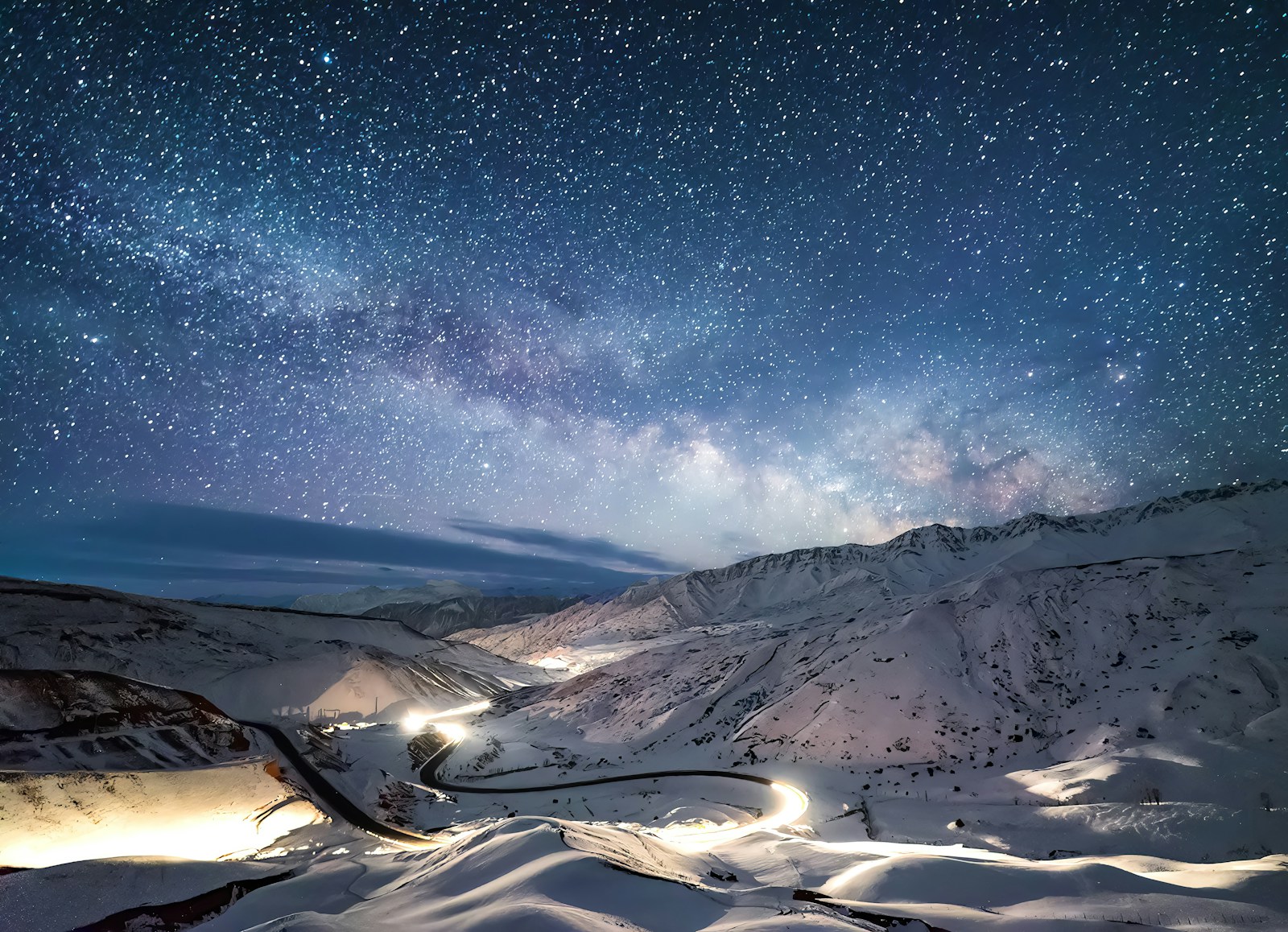 the night sky is filled with stars above a snowy mountain