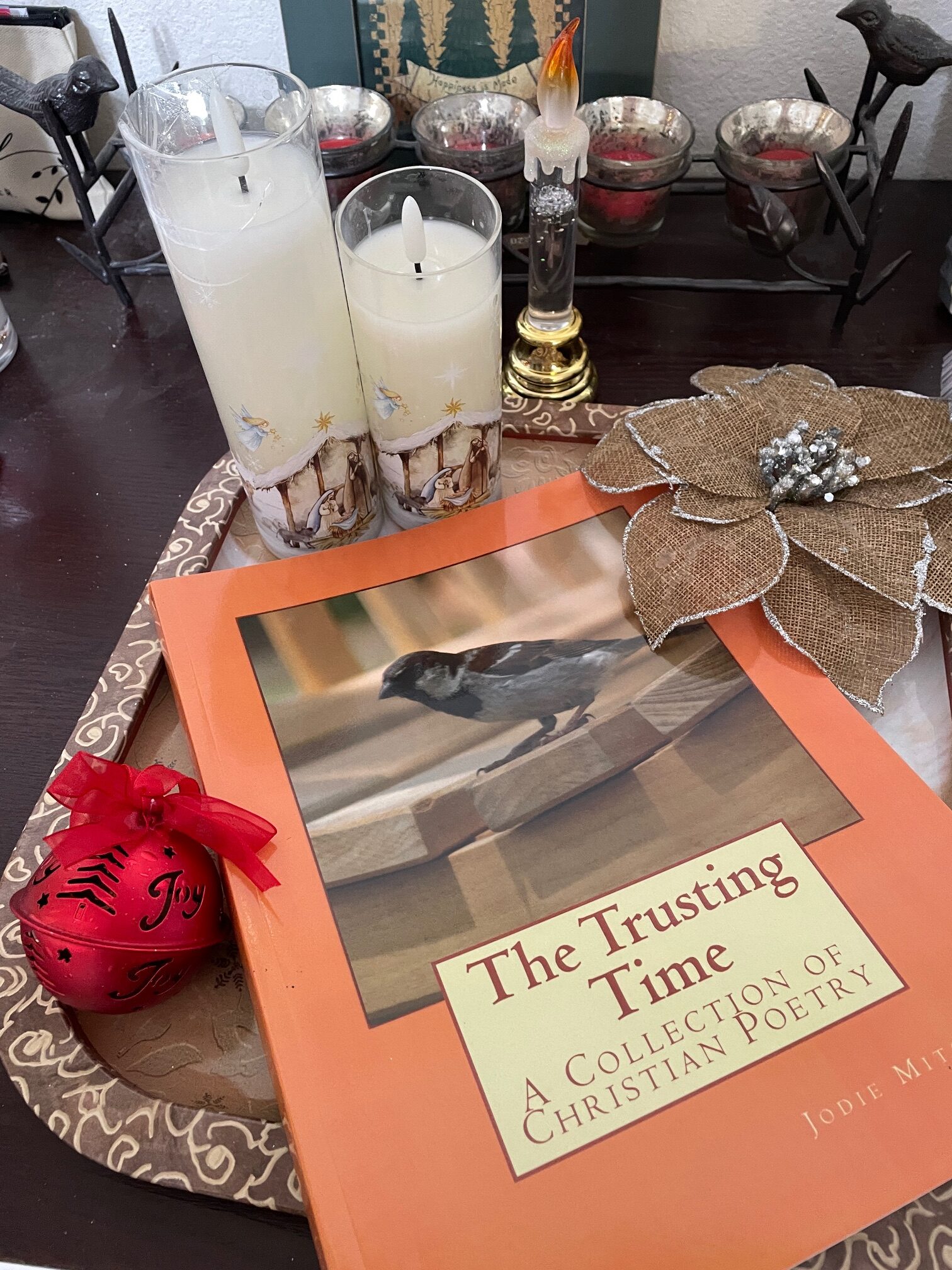 pink rose in gray ceramic vase on white table